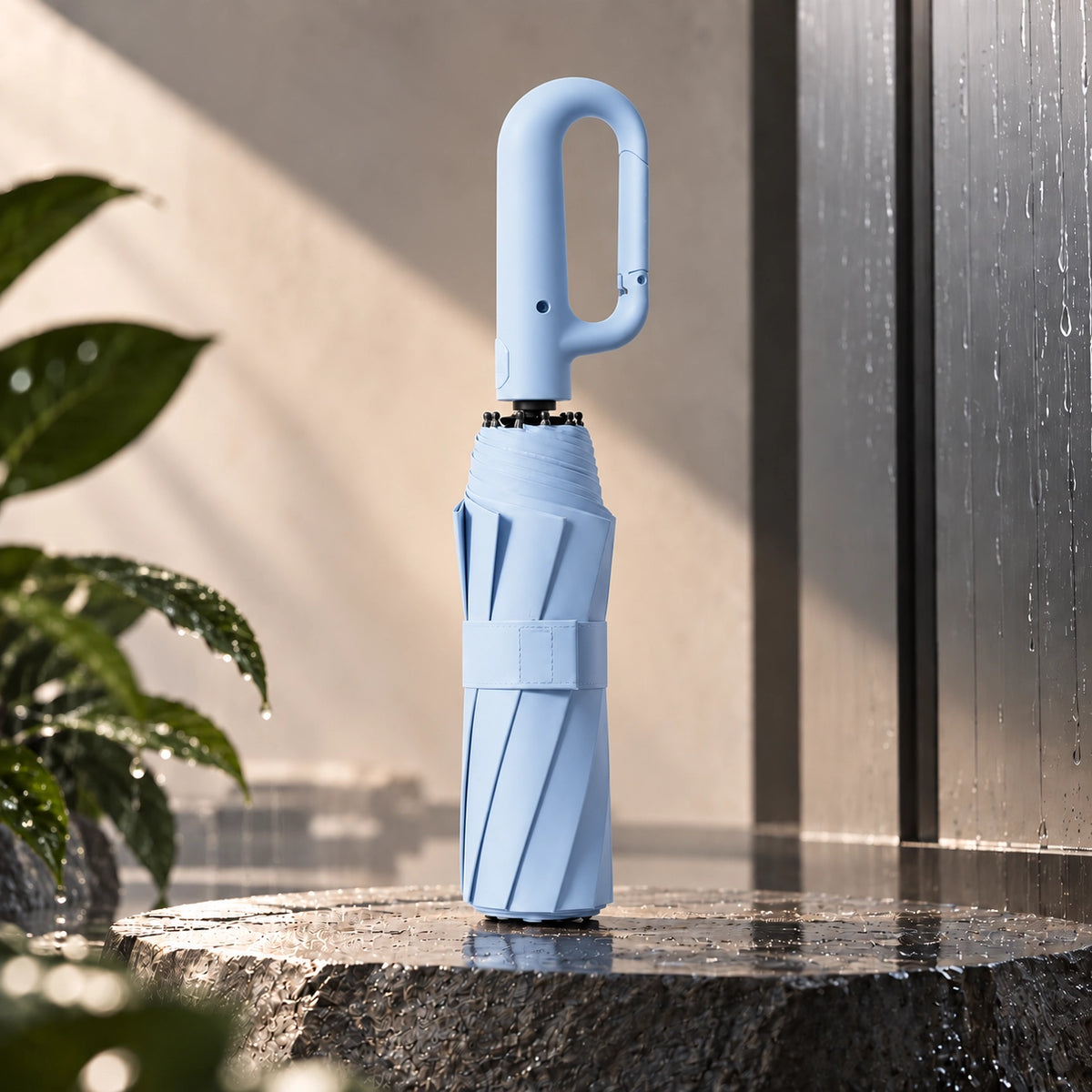 Brellova One in Sky blue, folded, standing on wet stone